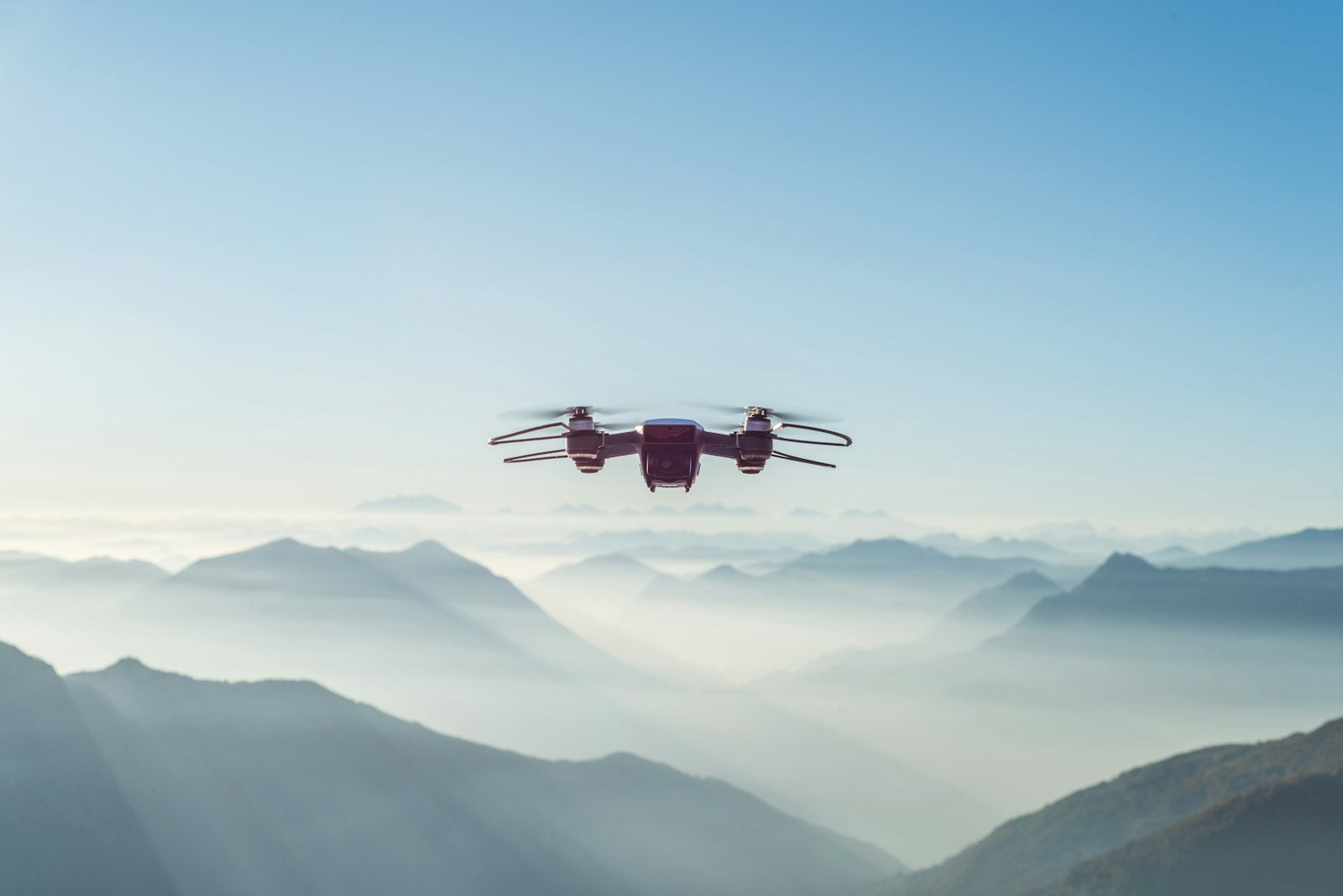 Aeron camera drone flying over mountains